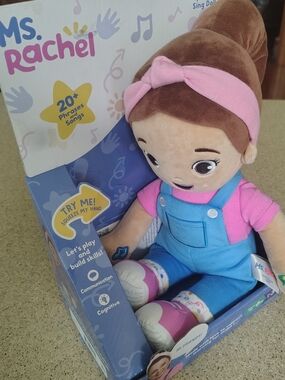 Rachel Plush Sing-Along Doll in Pink & Blue Overalls. HCL